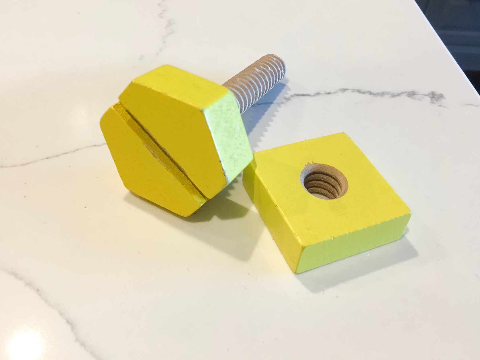 wood toy bolt and nut from toy building set is so cute and can be repurposed as decor in children's rooms