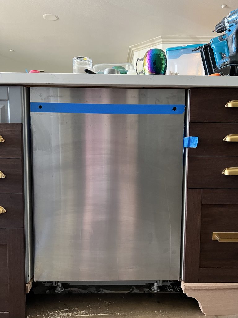 the handle holes helped hold the panel in place while I lined it up with the other doors and took my measurements for adding a dishwasher panel to my standard dishwasher