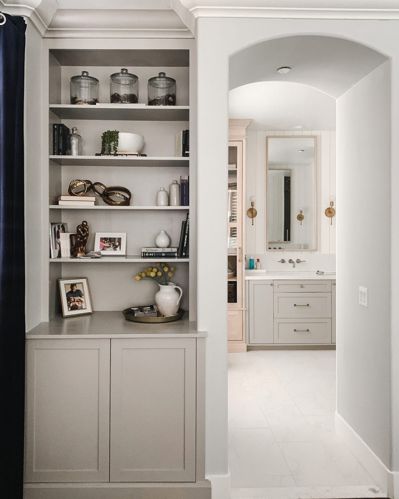 before the flood the view into the bathroom was bright and inviting, the vertical shiplap walls were painted benjamin moore simply white and the cabinets were feldspar pottery and cotton white. gold fixtures mixed with brush nickel created an interesting pallette.