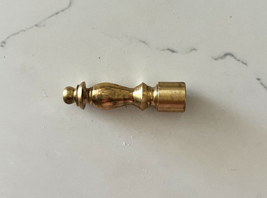 a brass finial is the perfect end piece for the lamp pipe but instead looks like a decorative accessory that cost way more than $3.50