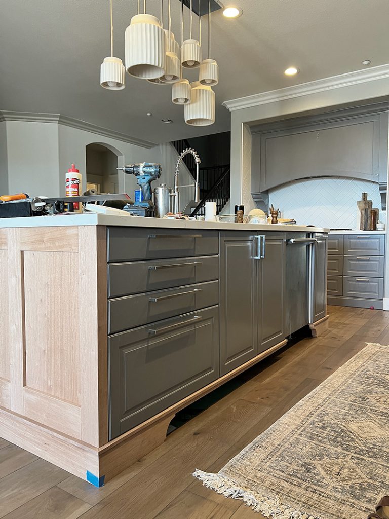during remodel mahogany wood veneers were added onto the Ikea sektion kitchen cabinets on the island for a refacing and cabinet update. custom trim was also applied and then later stained.