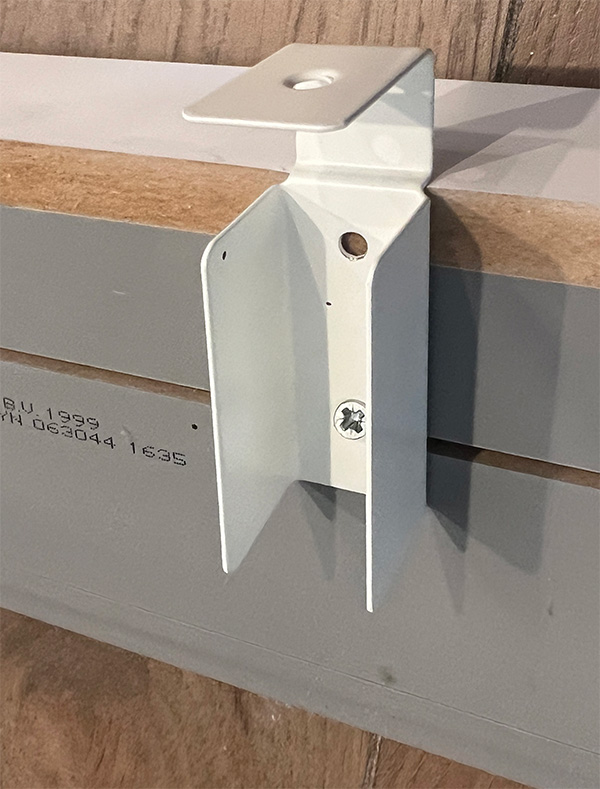 Ikea bracket attached to custom toe kick for ikea sektion kitchen cabinets.
